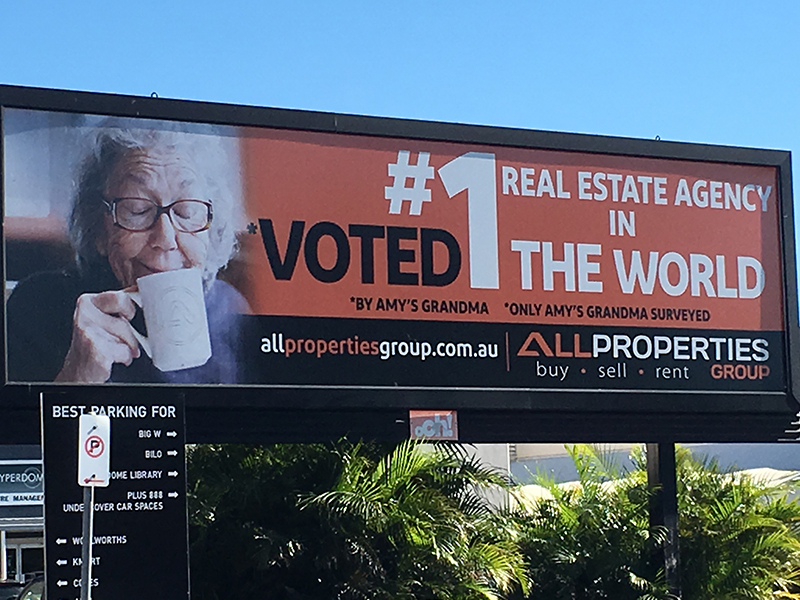 A billboard showing an example of some misleading marketing.