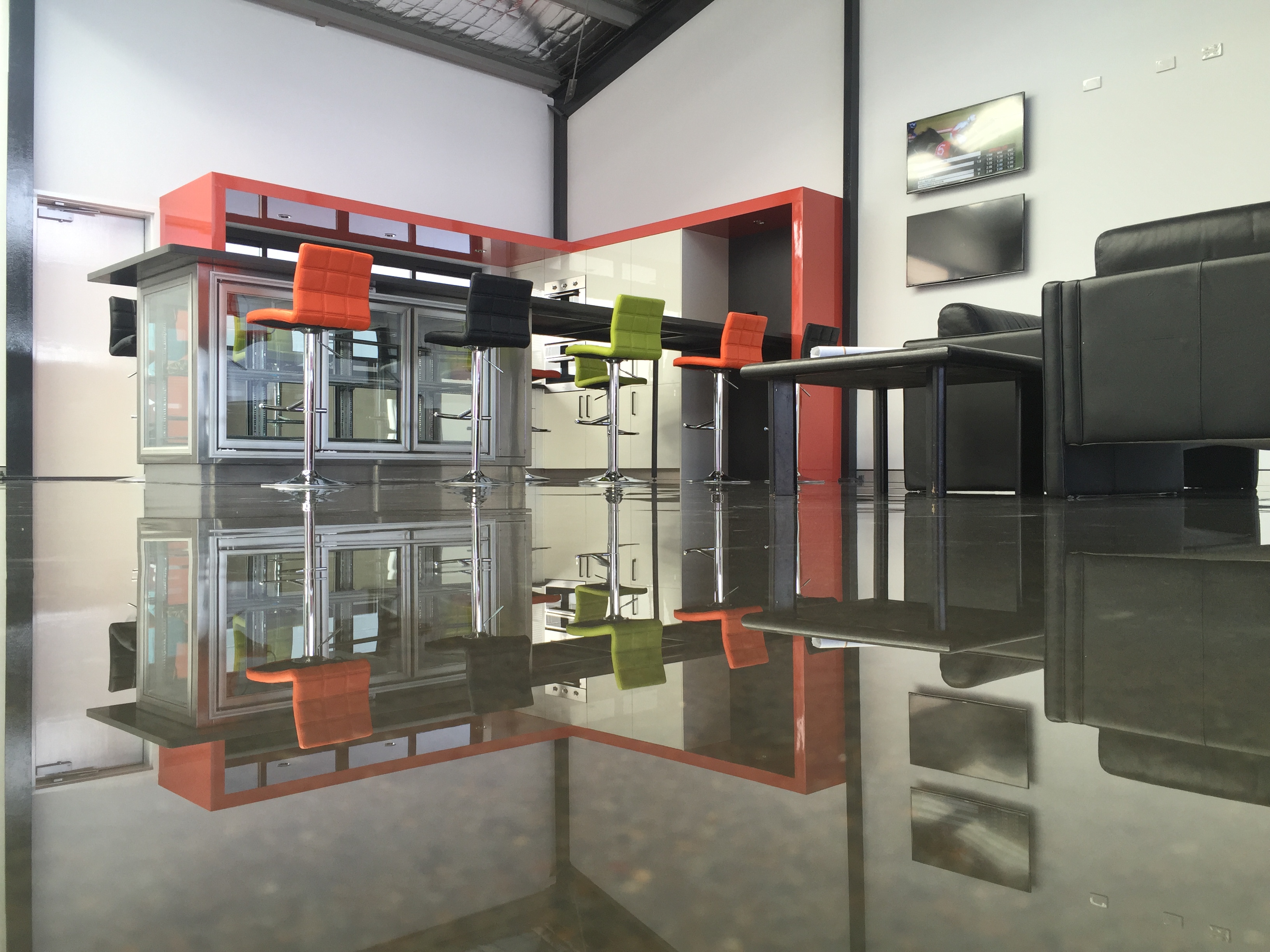 A clear epoxy resin was used to create a beautiful polished concrete finish in a modern apartment.