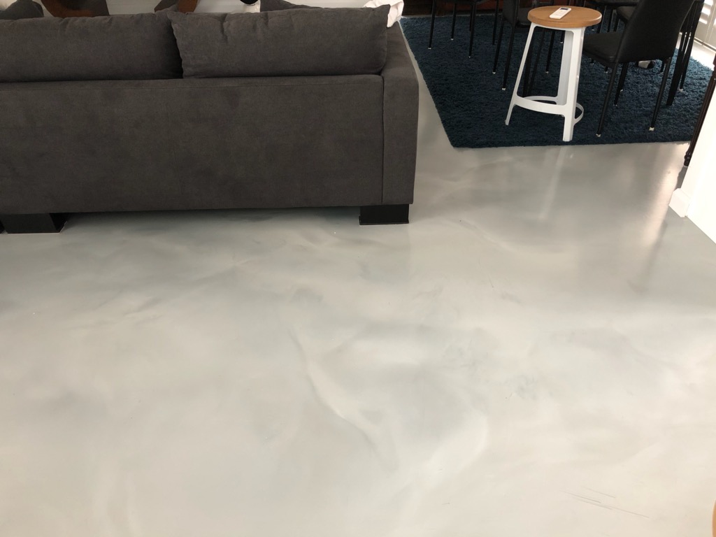 A beautiful metallic decorative floor used to great effect in a residential living space.