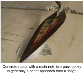 An epoxy patch repair product being trowelled into a large gouge on a concrete slab.