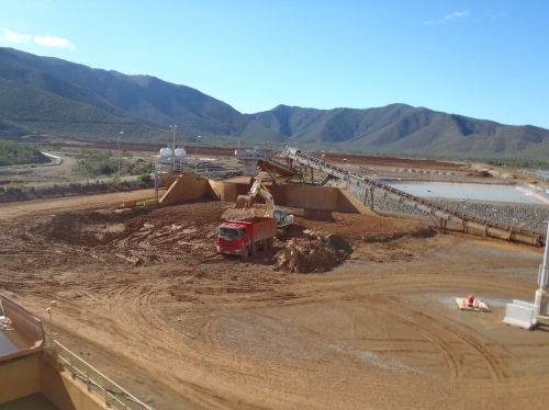 Truck being loaded on concrete platform of nickel mine protected by industrial epoxy flooring.