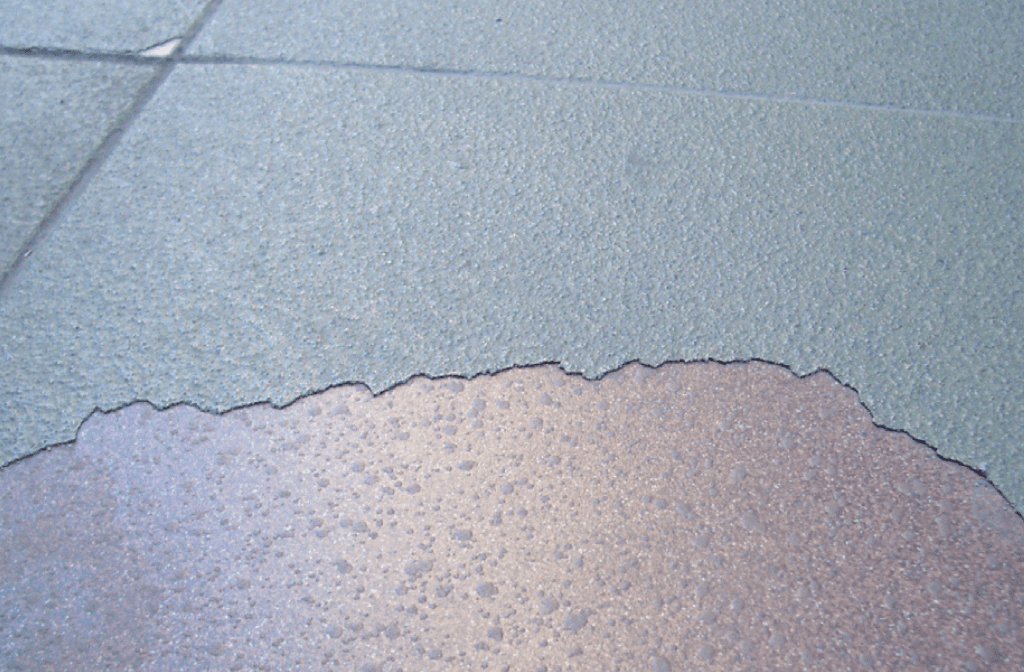 An example of adhesion failure on a resin floor applied over tiles.