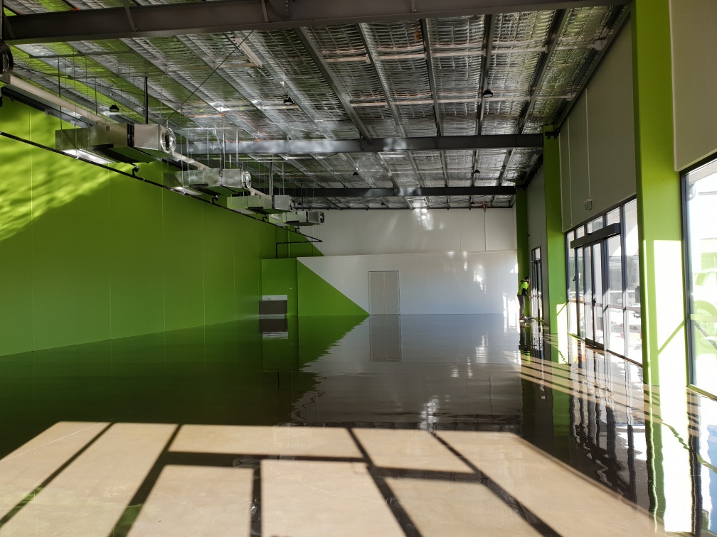 A clear commercial floor option used in a large display showroom.