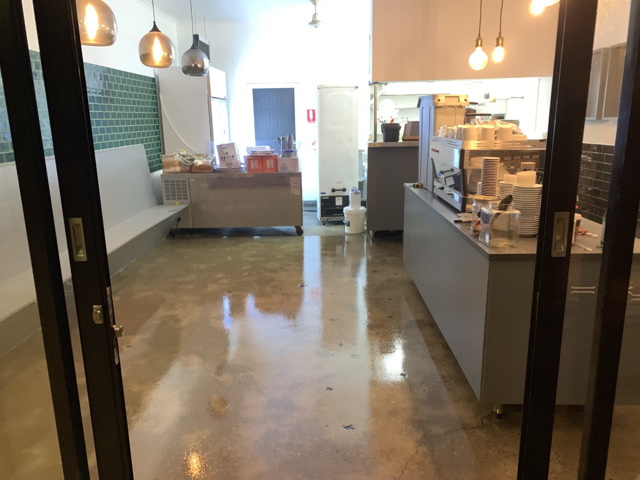 A clear commercial floor installed in the serving area of a fast-food restaurant.