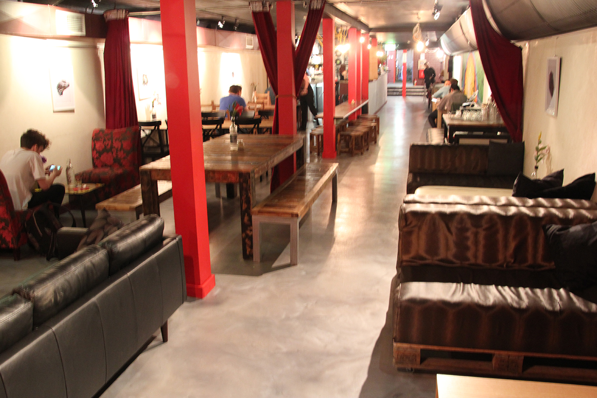 A metallic epoxy commercial floor in a trendy city cafe.