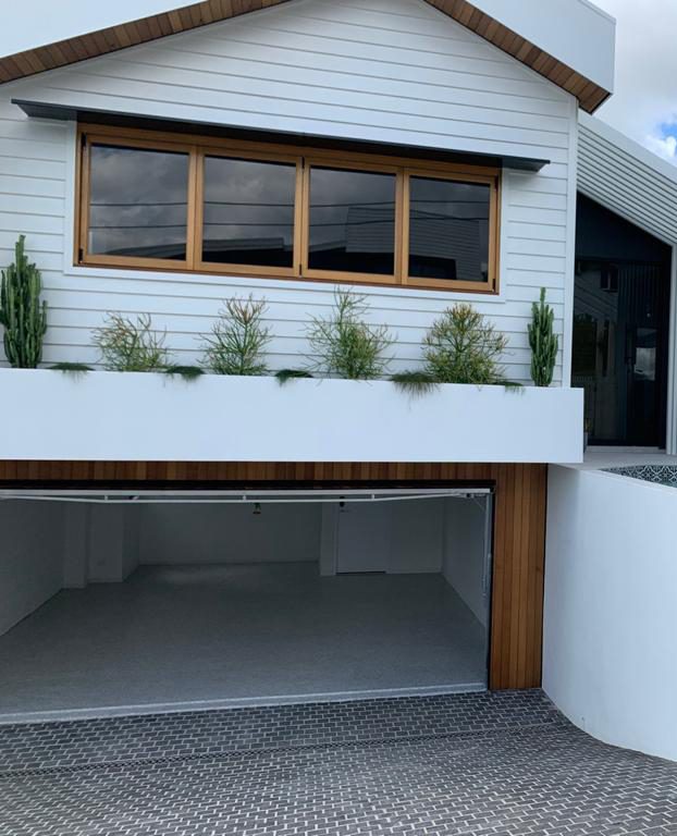A neat and tidy garage after epoxy flooring installation has been completed.