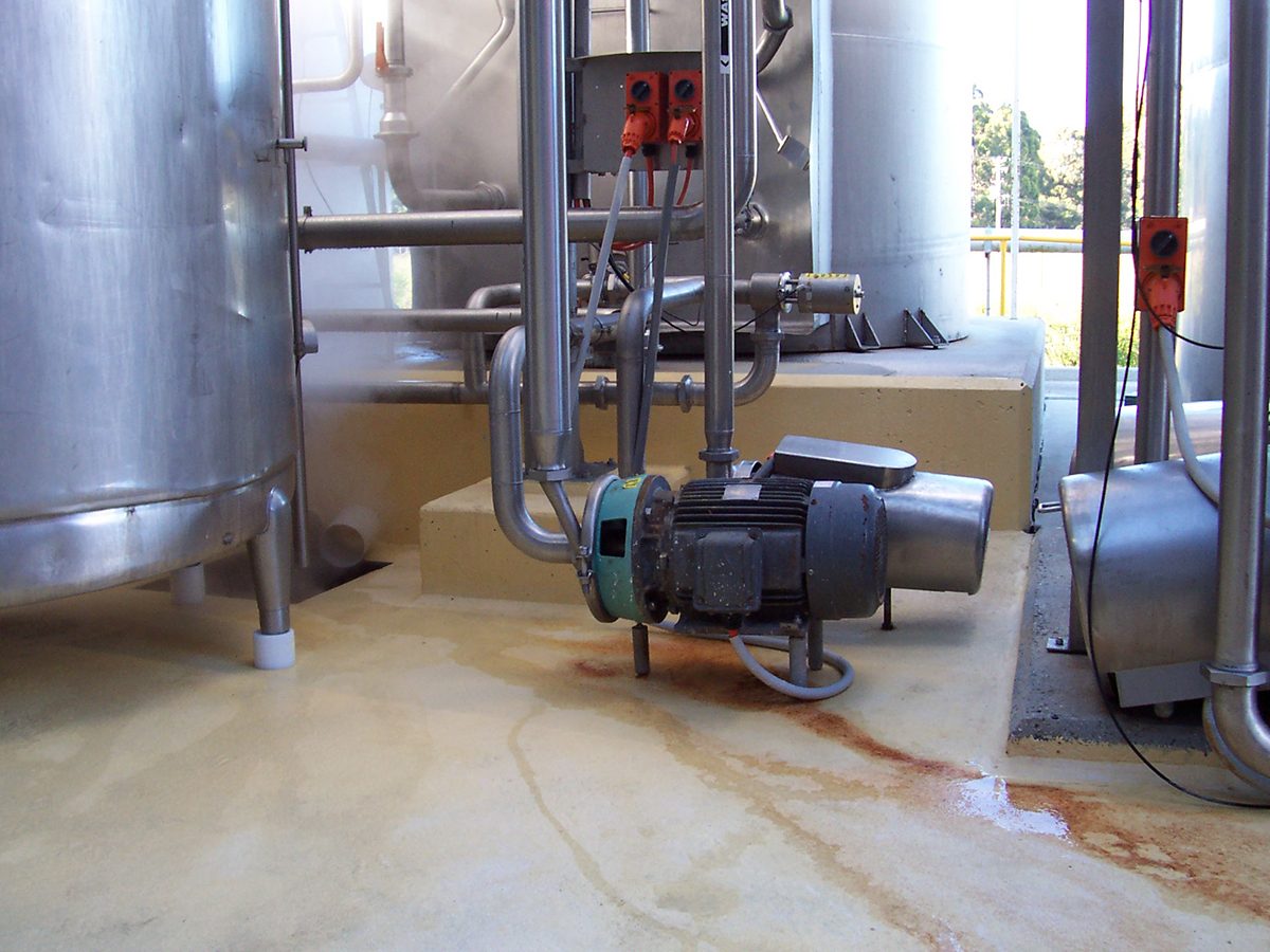 Epoxy flooring with high moisture tolerance used in a food processing facility.