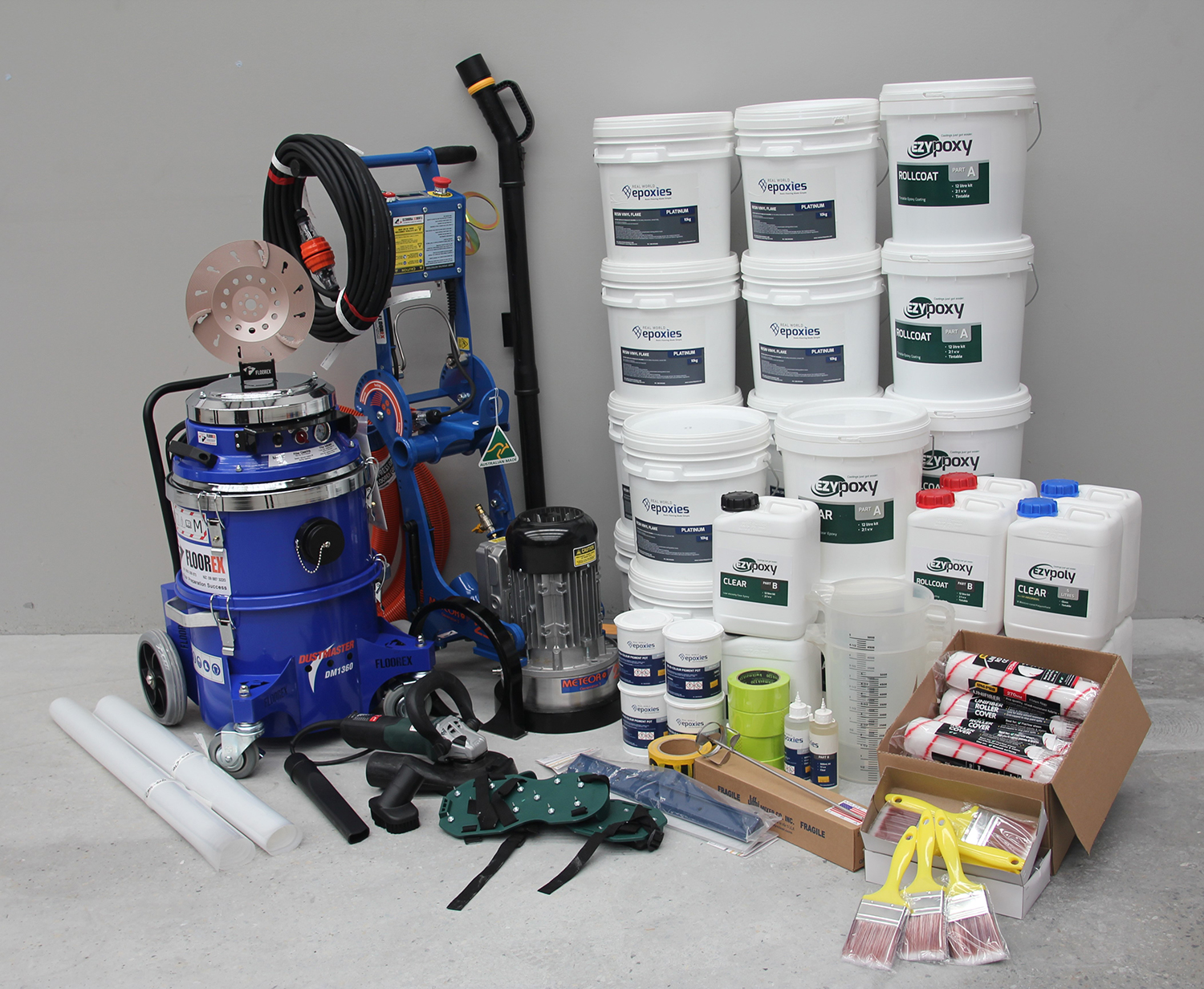 The products offered as part of the epoxy flooring business package, including grinding equipment and floor coatings.