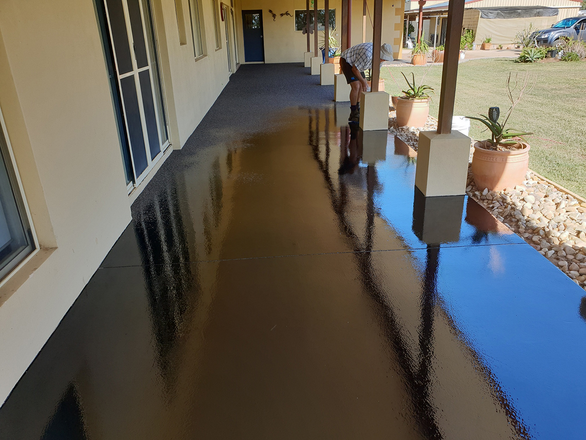 A low-angle shot of a floor in a commercial kitchen showing the texture of the non-slip finish.