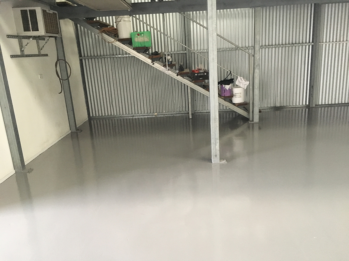 A room in a commercial kitchen that used Jaxxon industrial coatings on the floor and around the drains.
