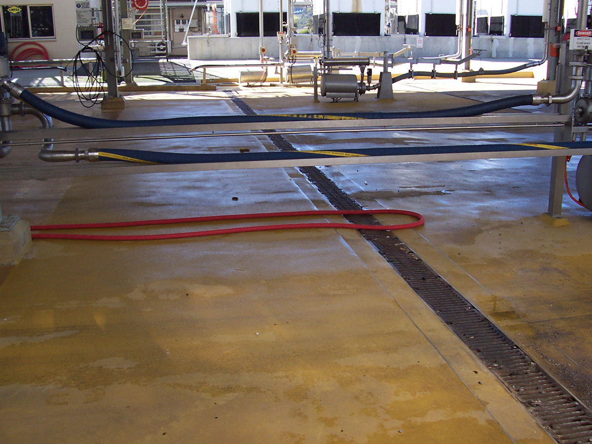 Jaxxon industrial coatings in service in a loading zone at a chemical processing facility.