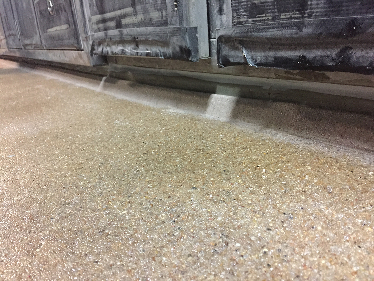 Jaxxon industrial coatings used to level and cove flooring on Navy vessel.