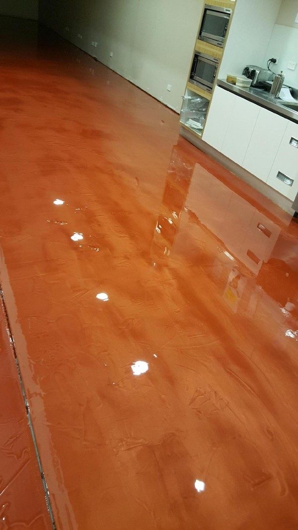 A brilliant bronze metallic floor installed in a community centre.