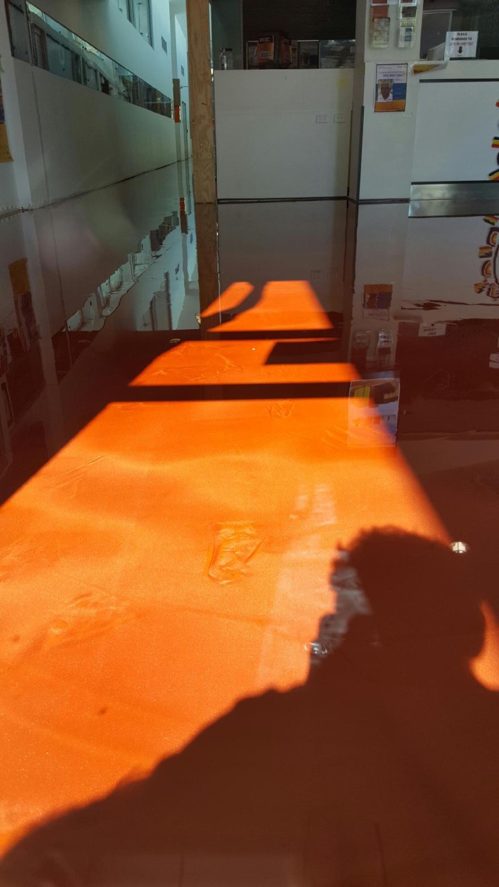 A close up of a red earth metallic finish that was created using Artepoxy Liquid Crystal.