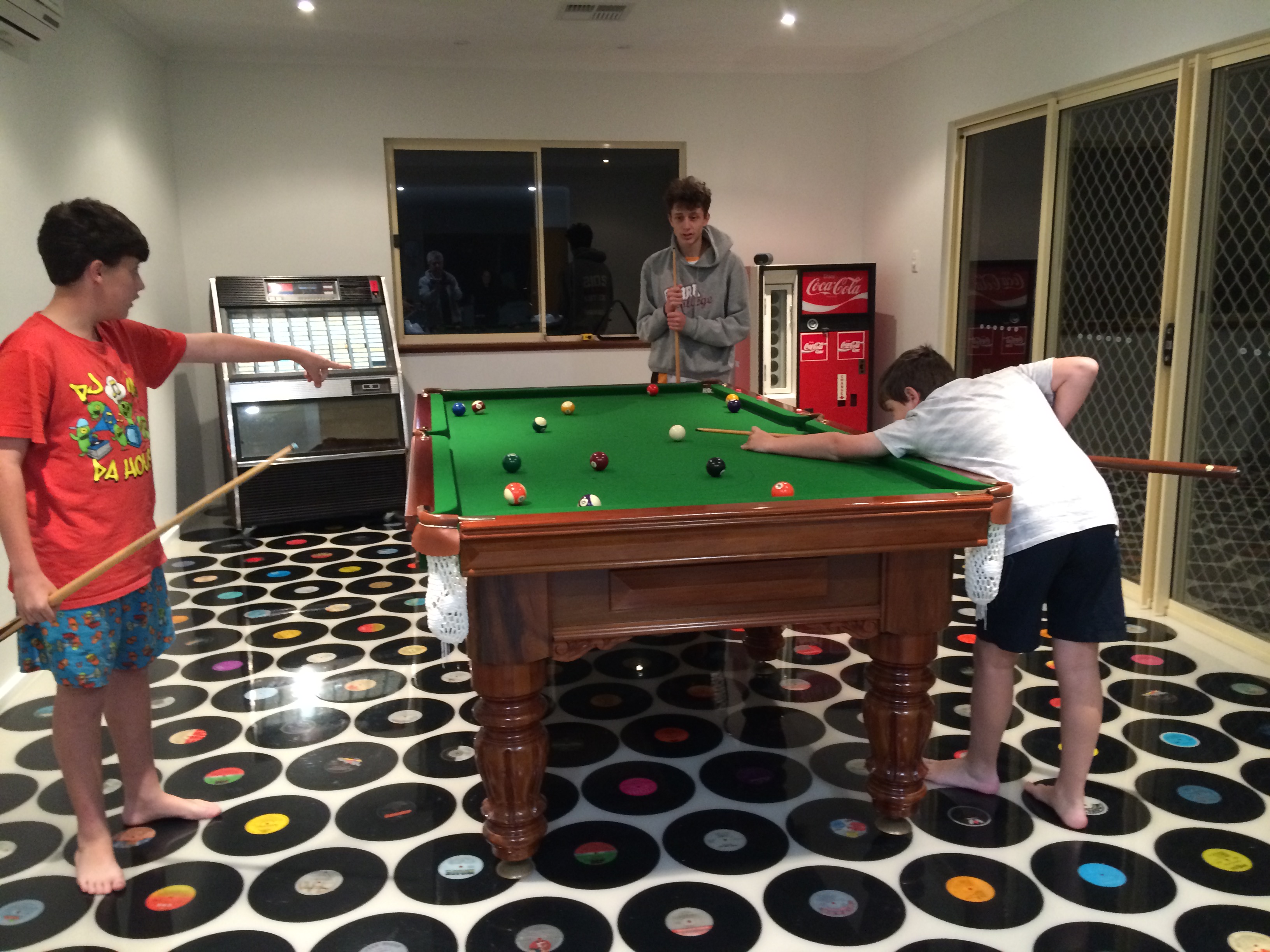 A clear epoxy resin used as the topcoat to encapsulate vinyl records on a custom floor.