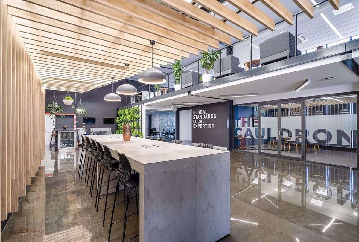 A clear, high-gloss polished concrete look created with a clear epoxy resin in a commercial office space.