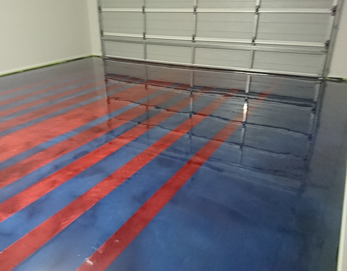 A residential garage used Artepoxy Liquid Crystal to do a custom floor in the colours of the FC Barcelona club.