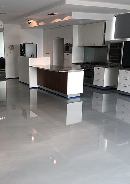 A stylish iron grey Liquid Marble floor installed in residential kitchen.
