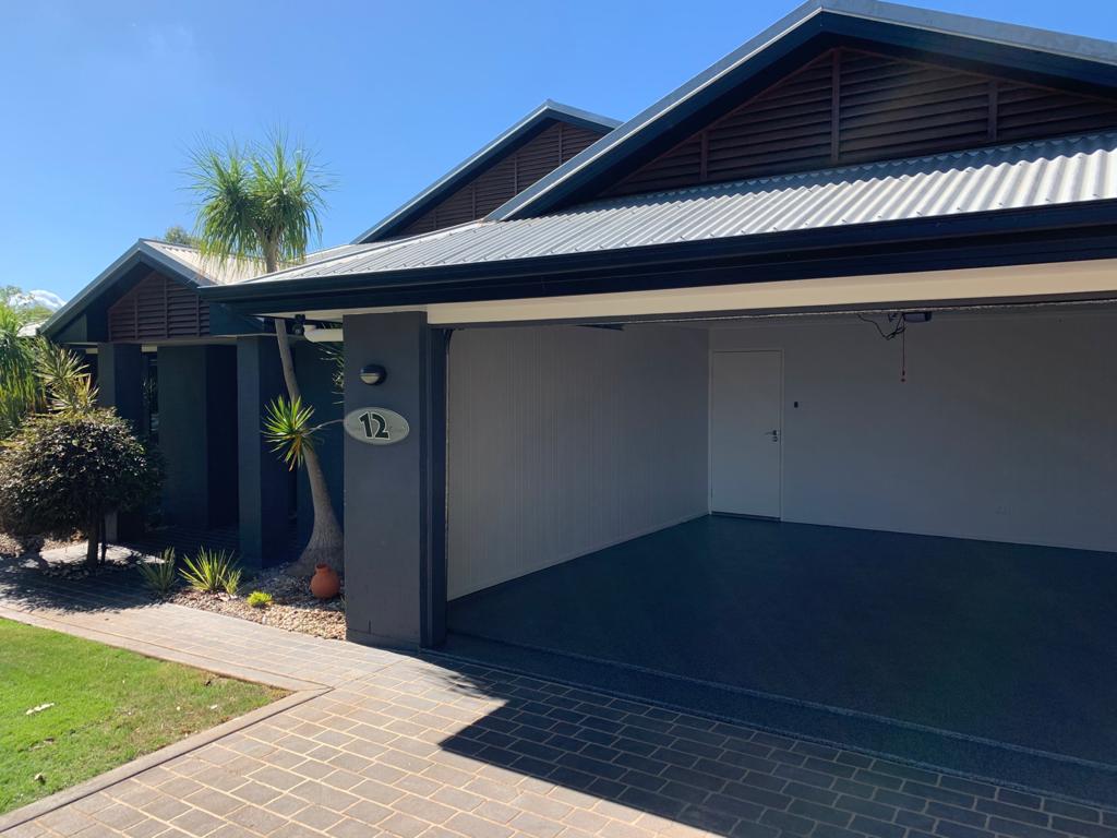A residential garage showing the new garage floor coatings applied inside.