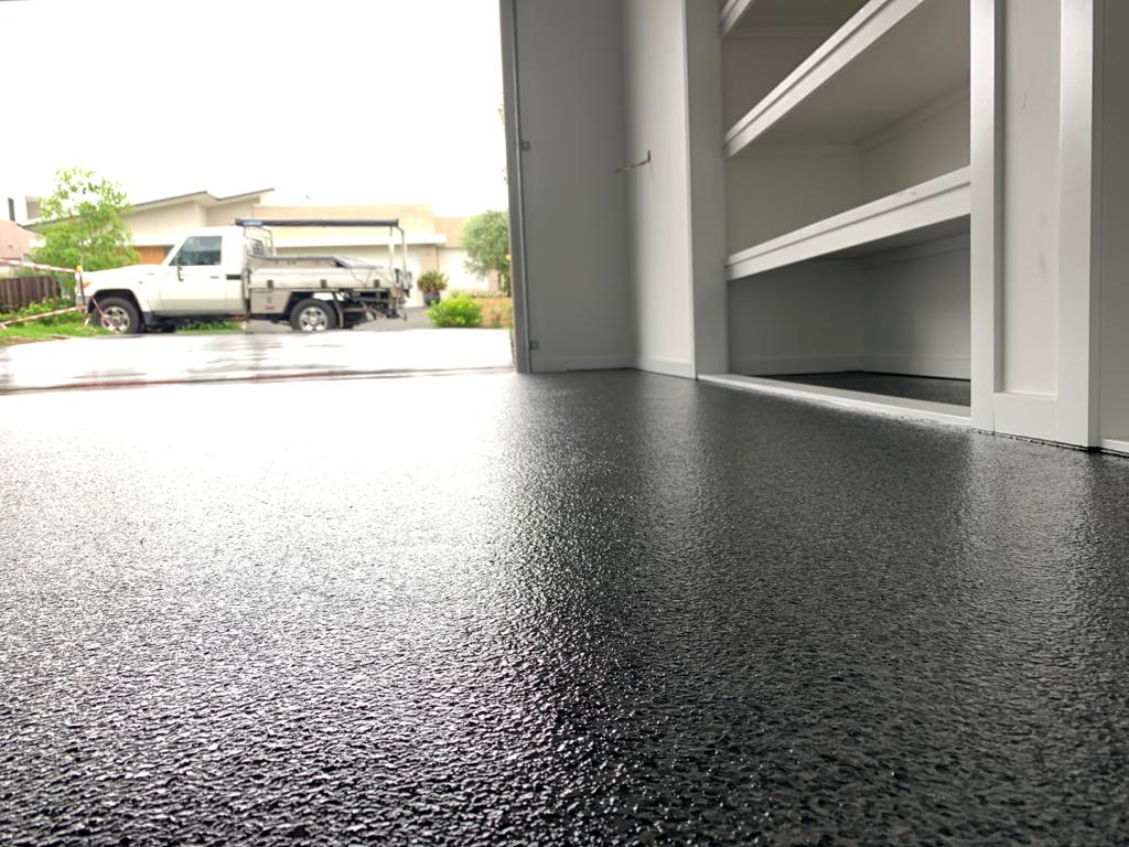 A low-angle photo of garage floor coatings with a beautiful even finish.