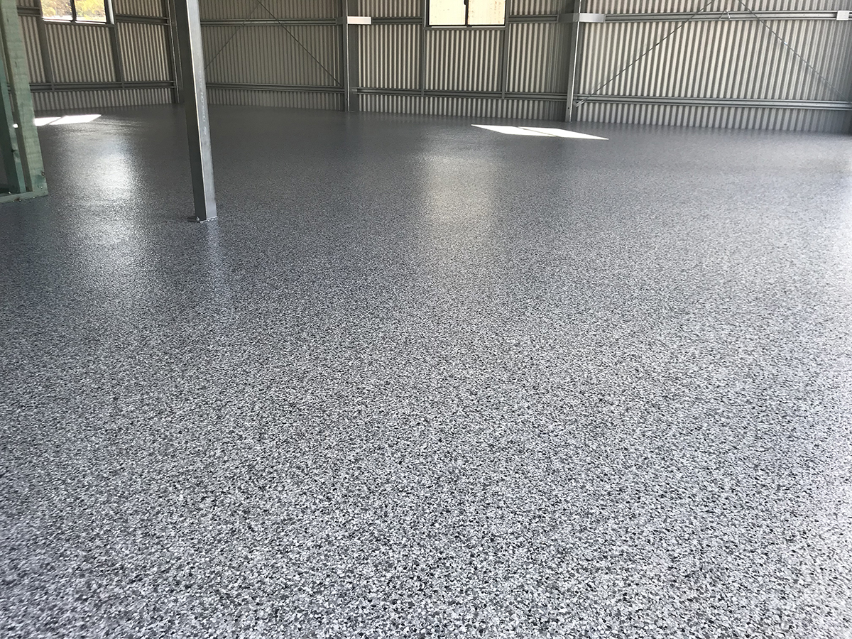 A large residential shed with a new epoxy flake floor in Ash colour.