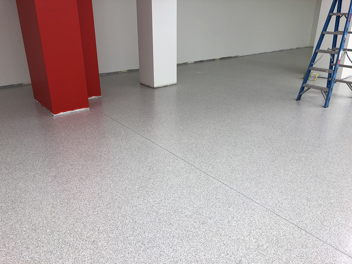 A flake floor with Ezypoly topcoat being used to renovate a toy store in a large shopping centre.