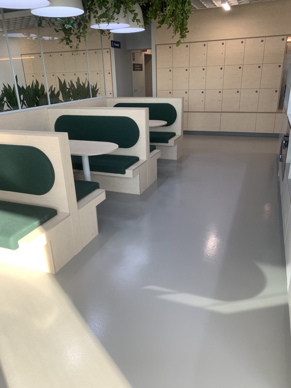 Ezypoly polyurethane with a matted finish on top of a stylish grey floor in a city office building.