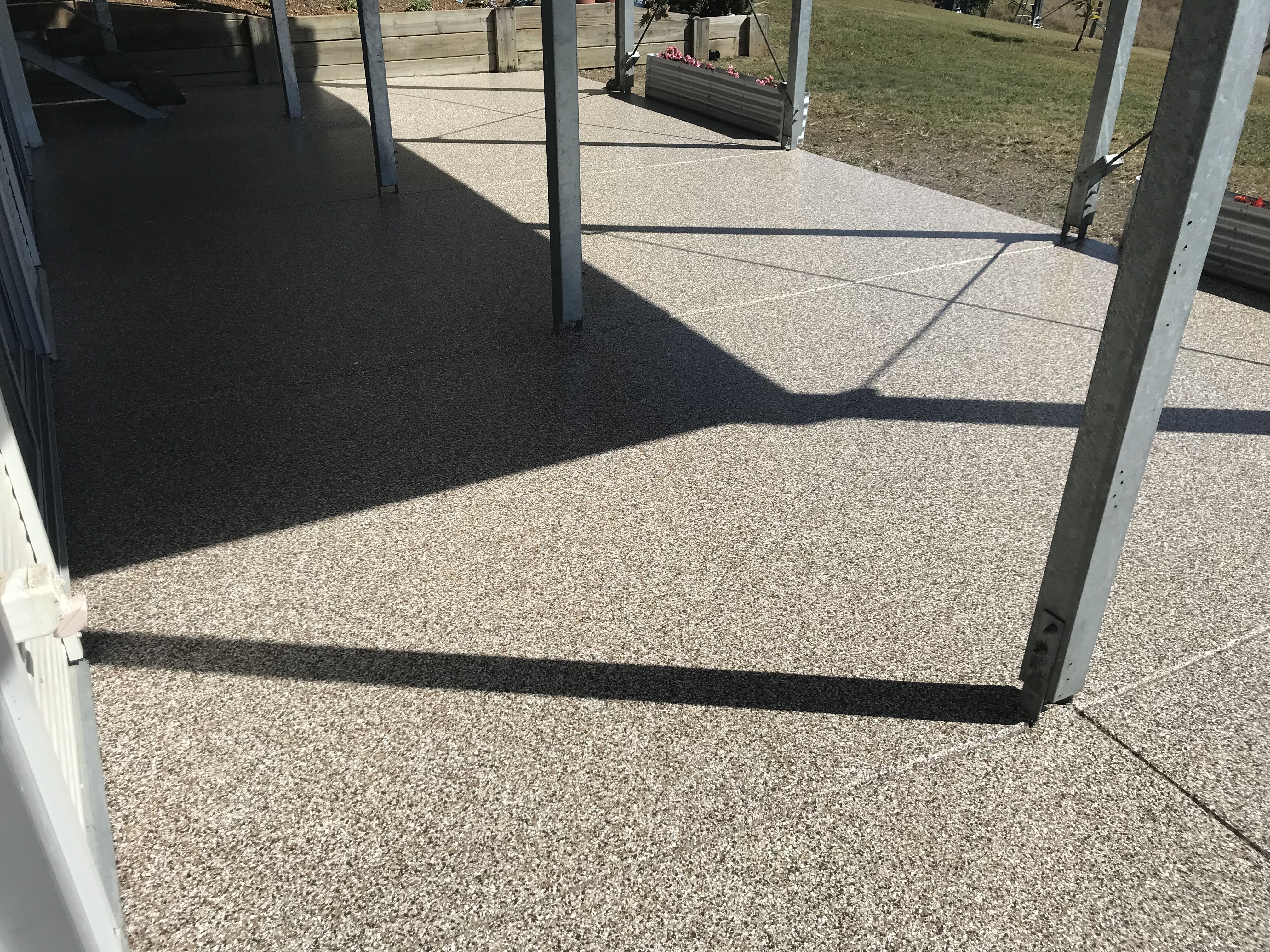 An outdoor area in a home with an epoxy flake floor installed.