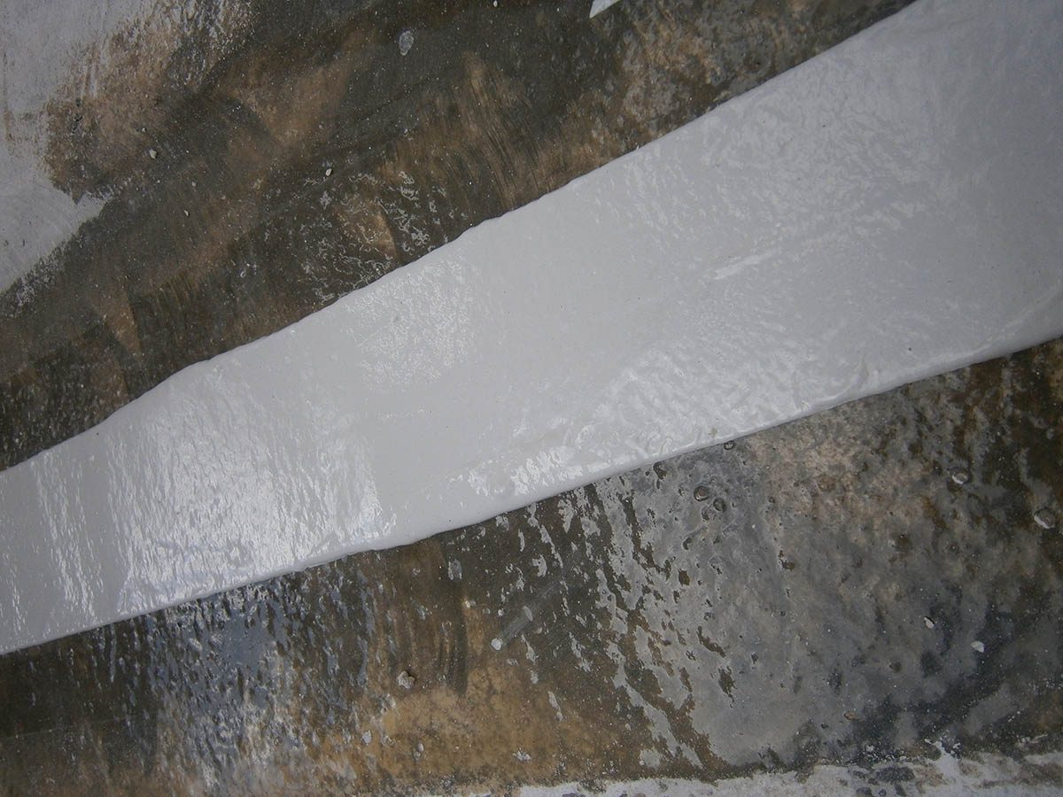 A close up of the repaired expansion joint showing the flexible sealant applied onto the primed edges.