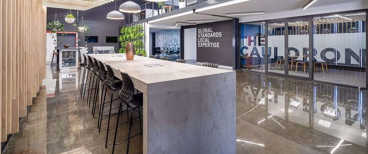 A clear epoxy flooring system from Real World Epoxies in the seating area of a commercial space.