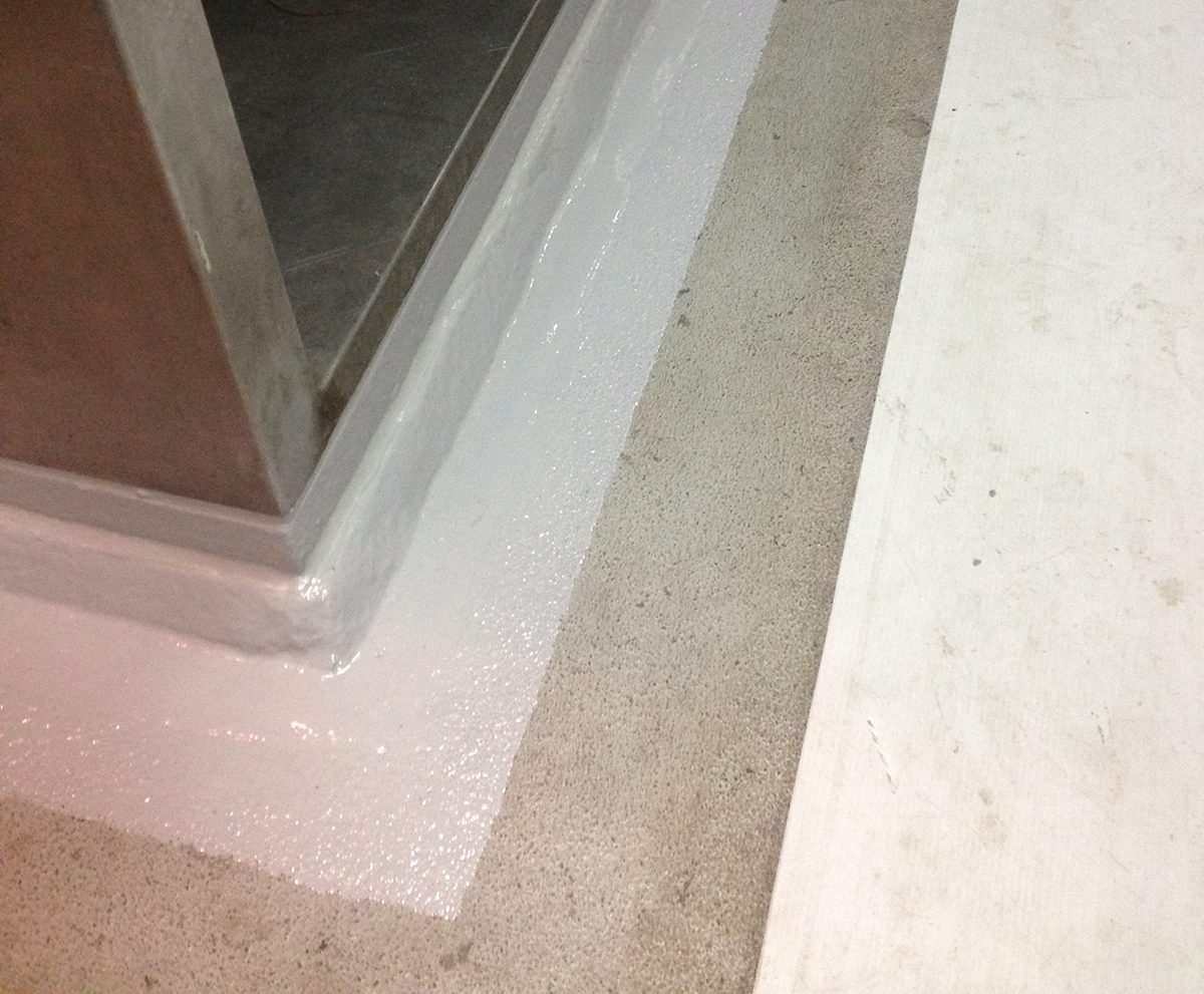 A close up of the edge of the flooring repairs showing the transition from new floor to old.