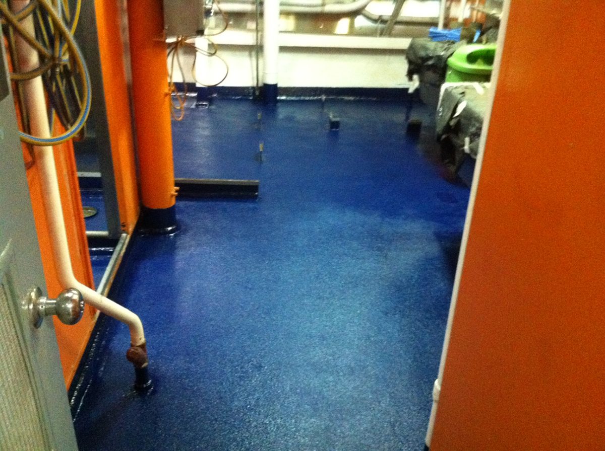 A photo of the wet space system taken after installation had finished, showing the Royal Blue non-slip finish in the sanitary space.