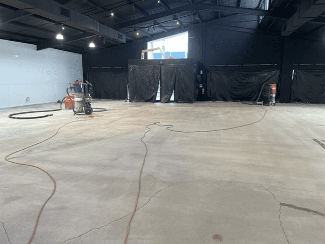 A photo taken during surface preparation from the back of the large warehouse that was to house the decoration supplies.