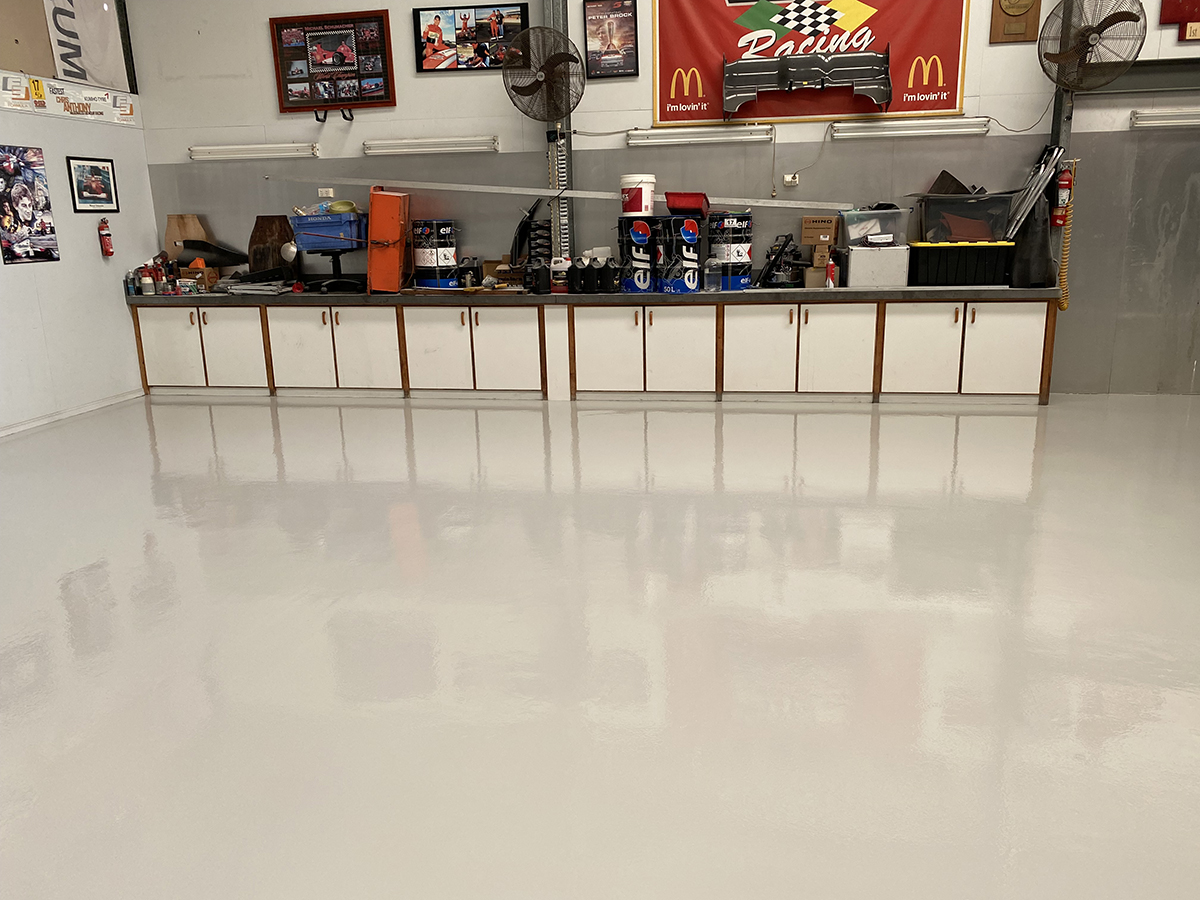 The back of the workshop, showing the new protective epoxy floor and the clean, professional finish.