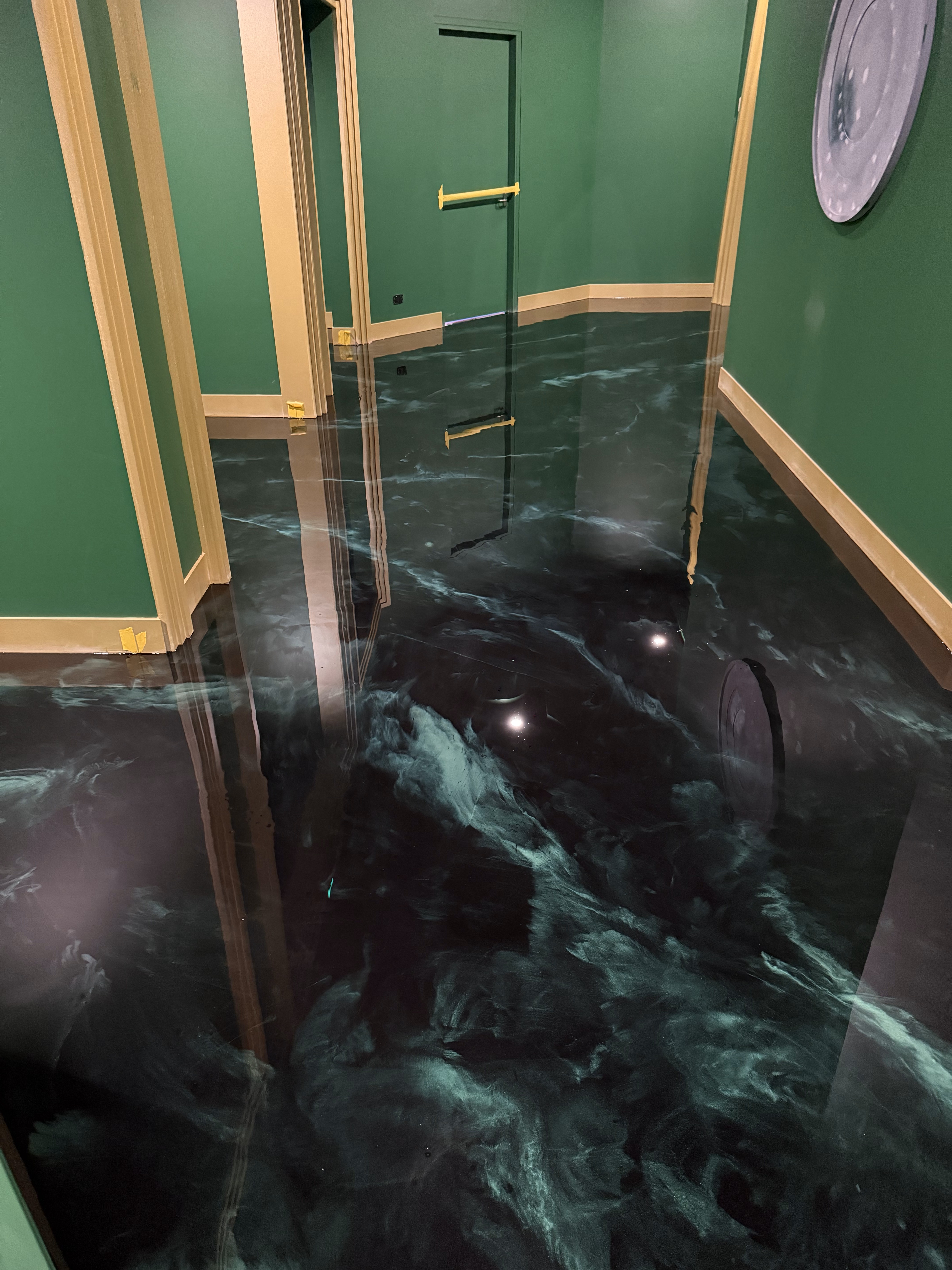 The cafe entrance, which had an old floor in place with an unusual orange colour and extensive wear and tear.