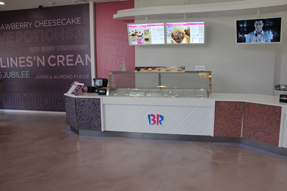 A custom metallic decorative floor in the customer serving area of a ice cream parlour.